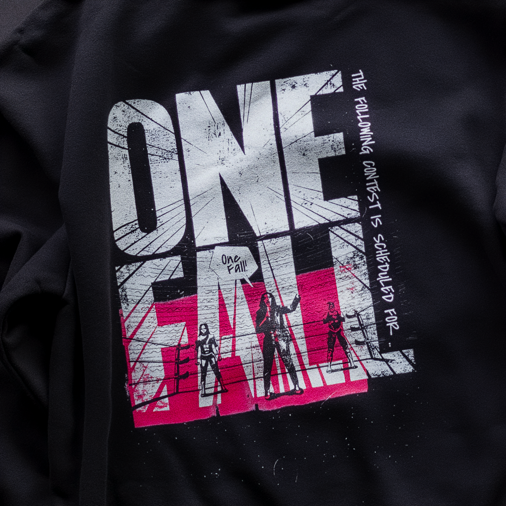 Detail shot of print quality on Cut 001 black hoodie showing fabric texture and design clarity.