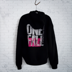 Cut 001 black hoodie back displayed on hanger showing natural drape and heavyweight fabric construction - against a white wall.