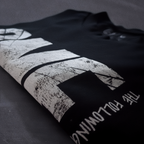 Detail shot of print quality on Cut 001 black t-shirt showing fabric texture and design clarity.