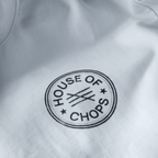 Detail shot of print quality on Cut 001 white t-shirt showing fabric texture and design clarity.