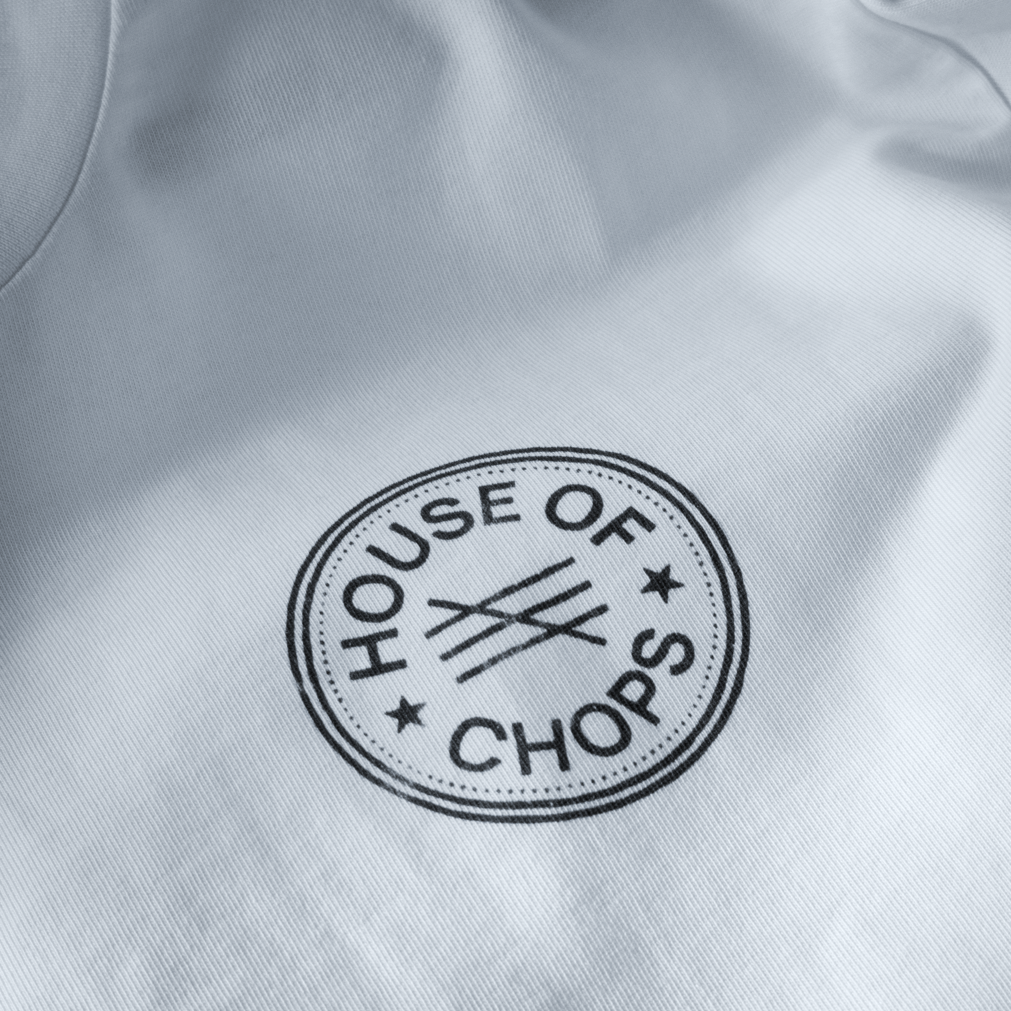 Detail shot of print quality on Cut 001 white t-shirt showing fabric texture and design clarity.